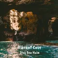 Sunlight streaming into a sea cave over turquoise water, the cover art for Vibrant Cave