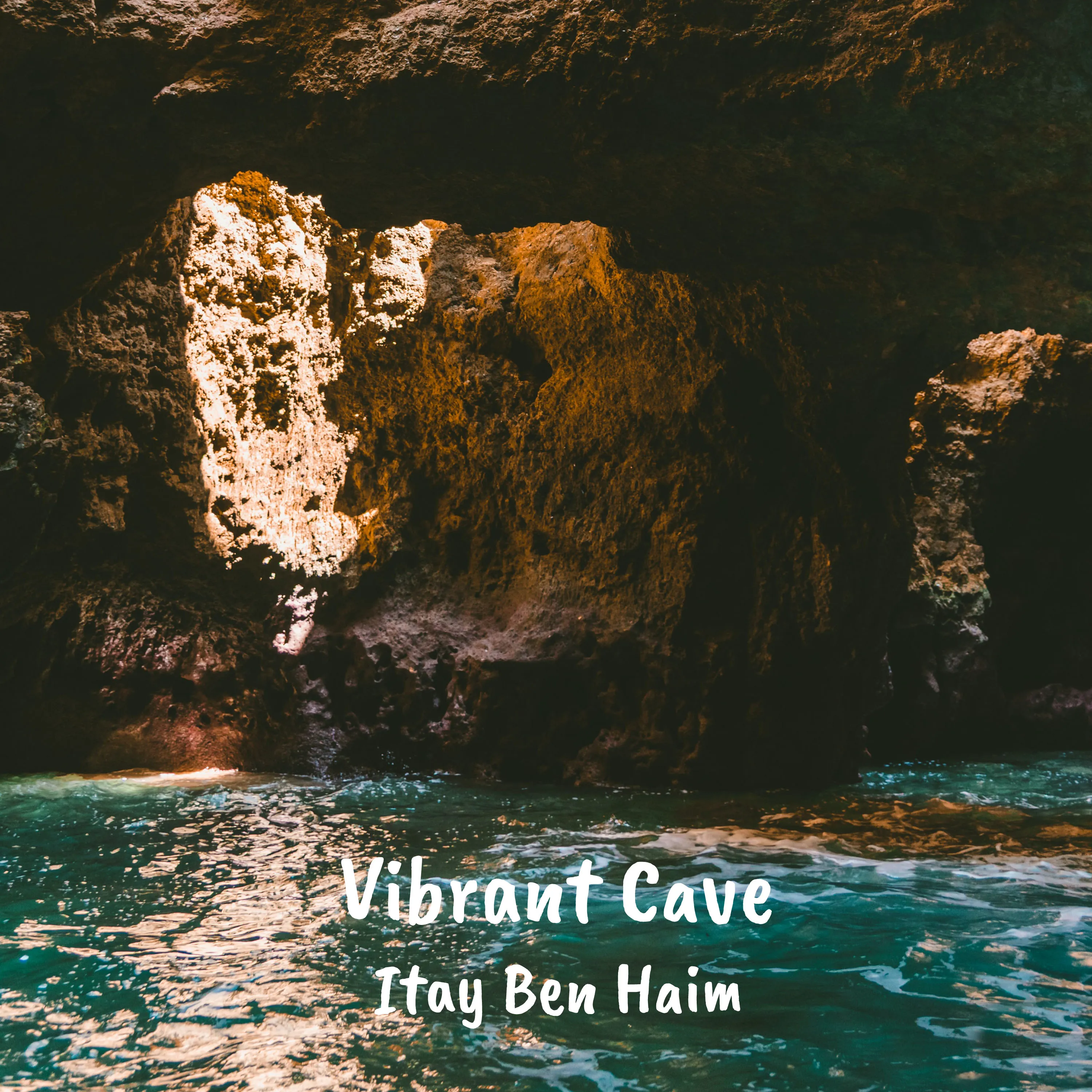 Sunlight streaming into a sea cave over turquoise water, the cover art for Vibrant Cave